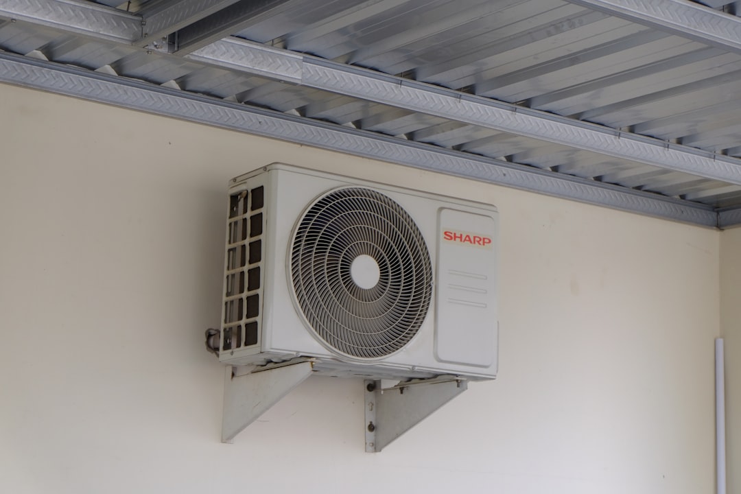 aging outdoor AC unit in a dusty Utah backyard during summer heat